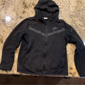Nike tech boys medium (black). It has two very small holes and worn 6 months.